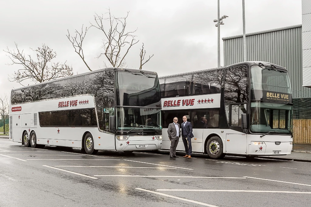 Phil Hitchen, managing director, right, with transport director Ian Bragg and the new double-decker coaches