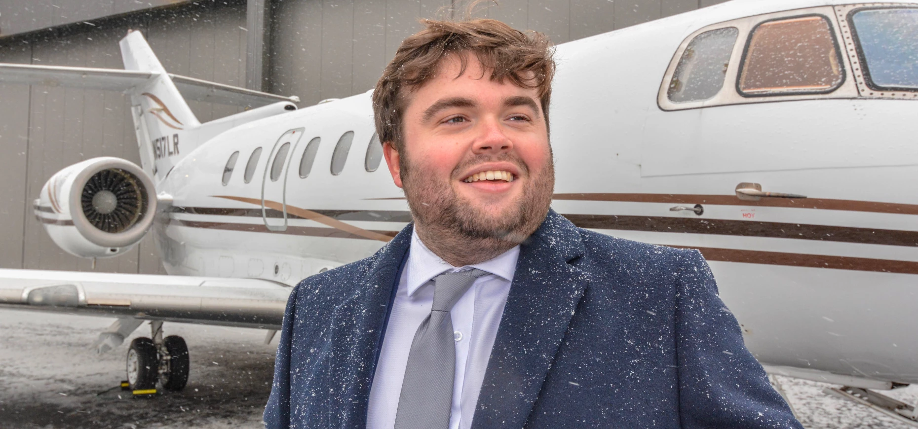 James Moon, Founder of Moon Jet Group, pictured in front of a plane.