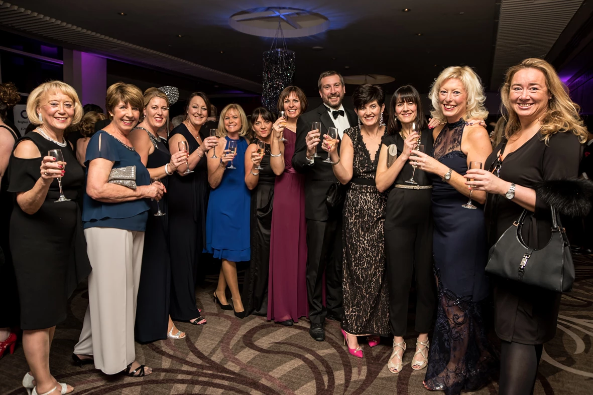 COCO Ball guests from the region's business community raise a glass to fundraising success