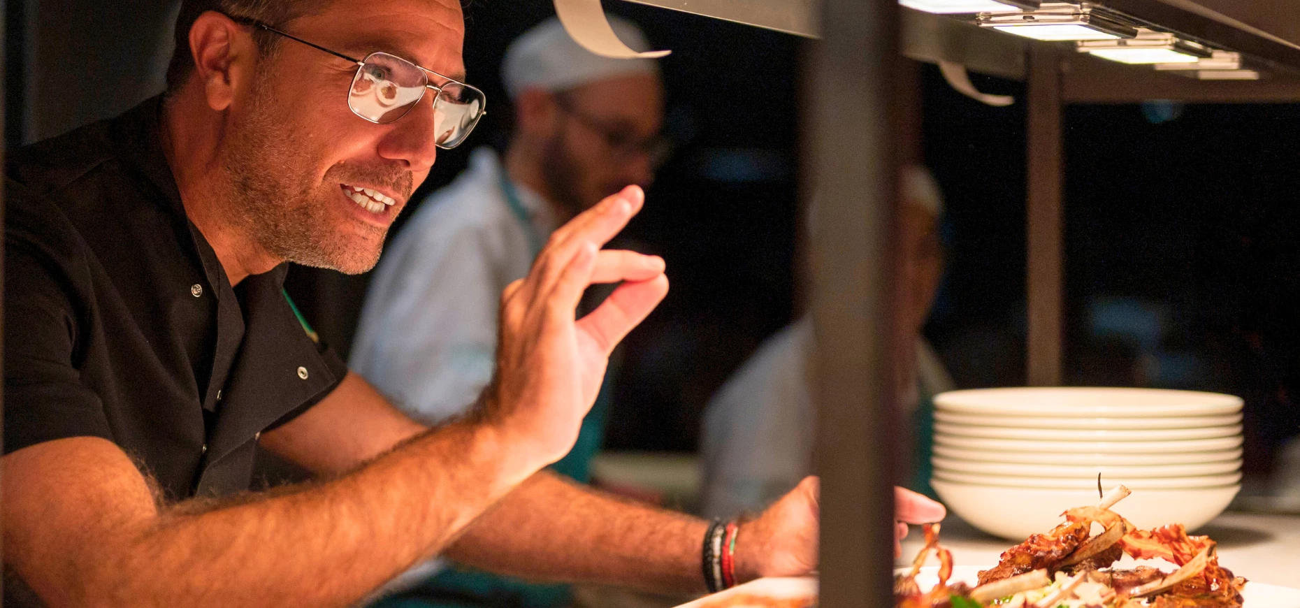 Gino D’Acampo working in the kitchen.